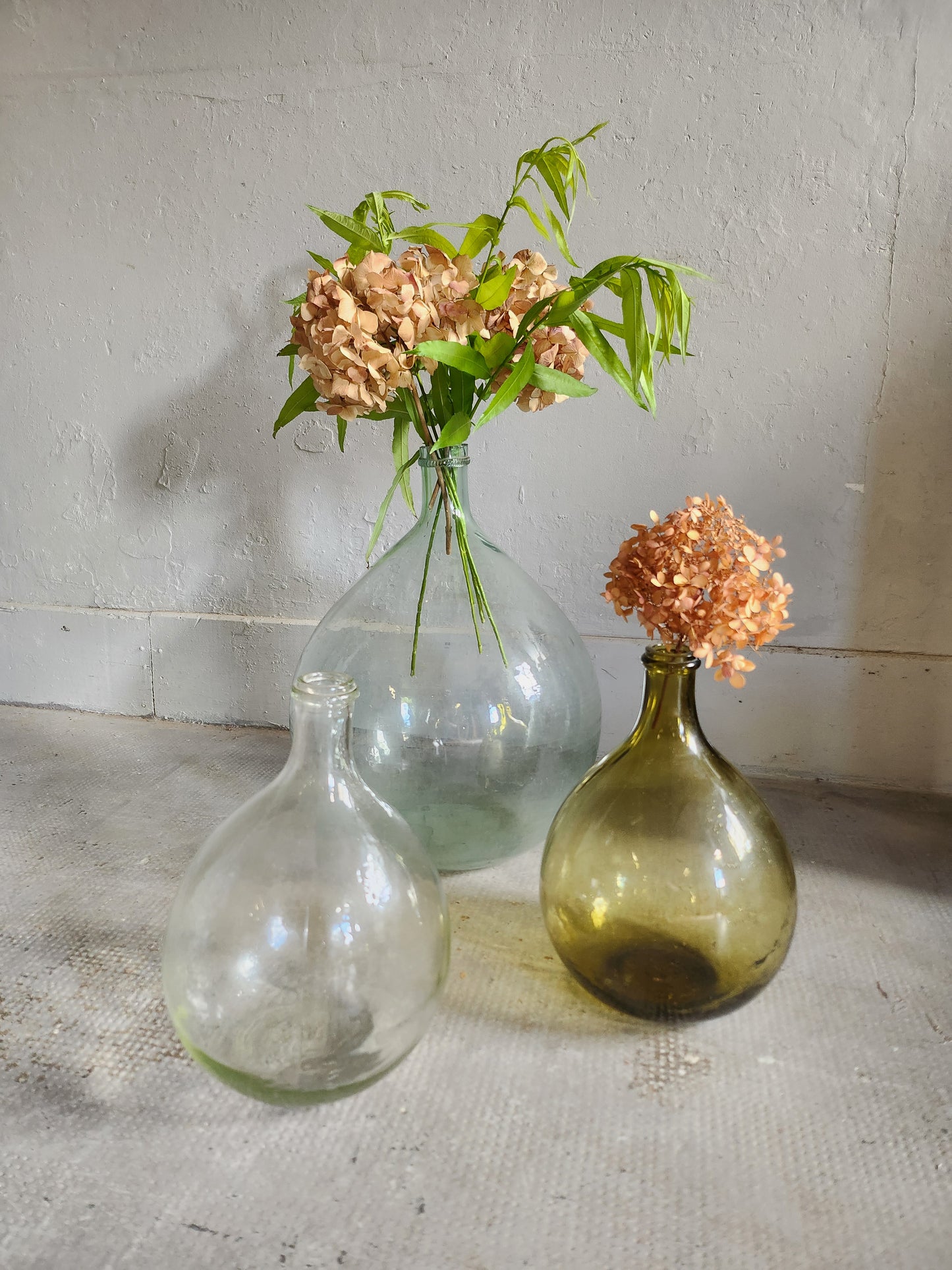 Grande dame-jeanne en verre transparent Patine