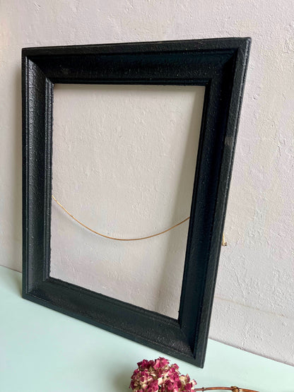 Cadre en bois peint en noir