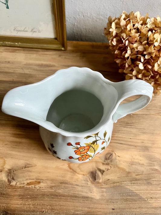 Pichet fleurs oranges