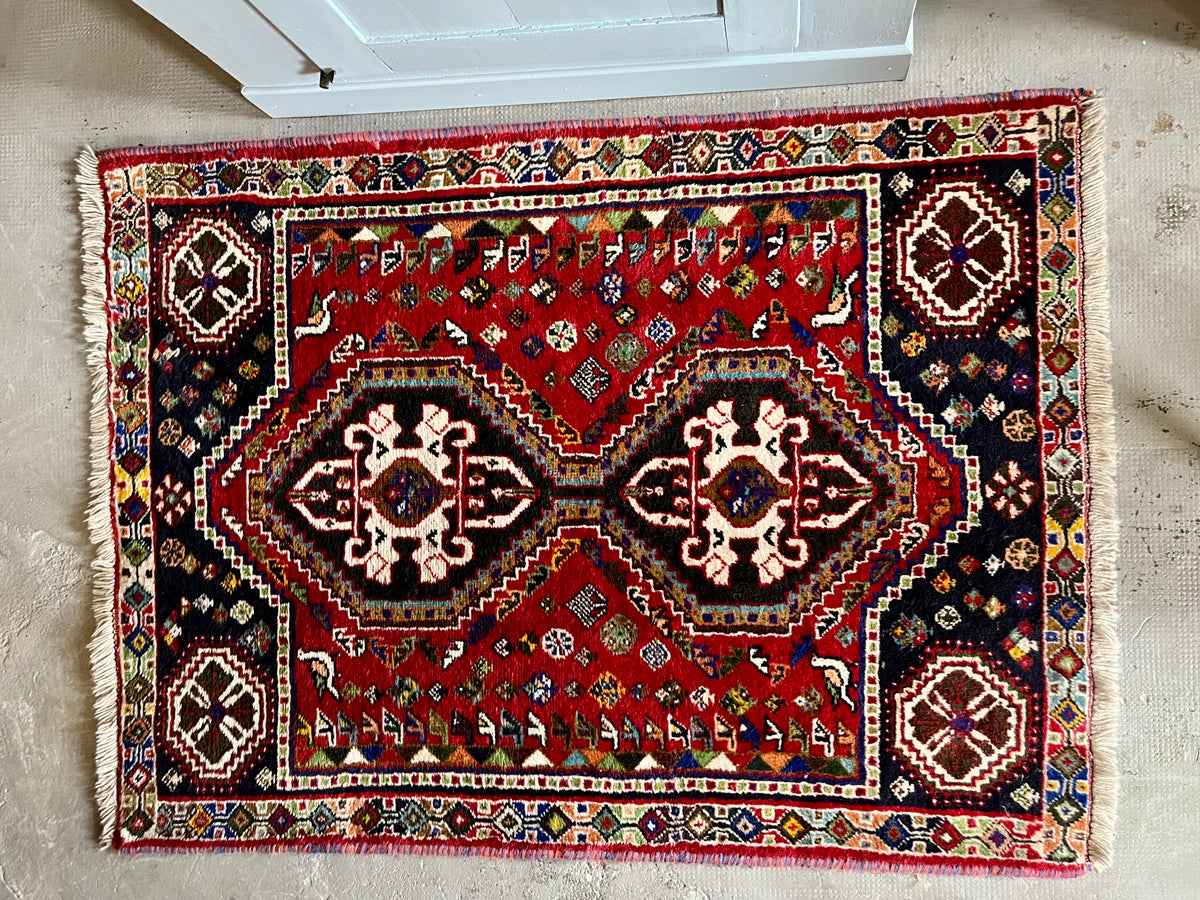 Tapis ancien à motifs  Décoration Patine