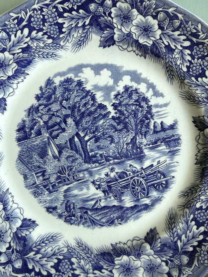 Assiette plate bleue décor paysage