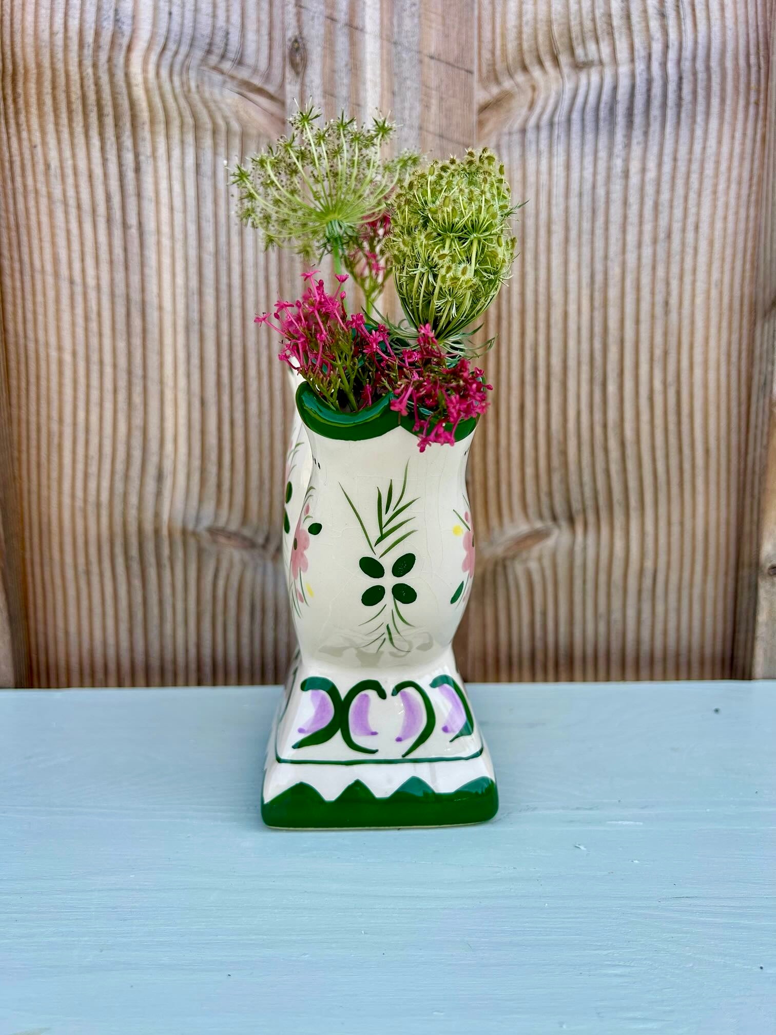 Vase en faïence fleurie ancien   Patine