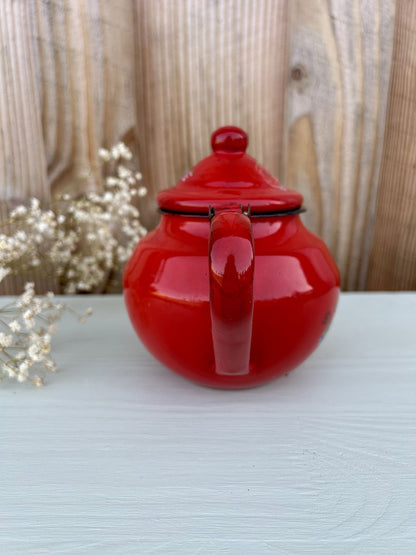 Petite théière vintage en métal émaillé rouge à motifs floraux