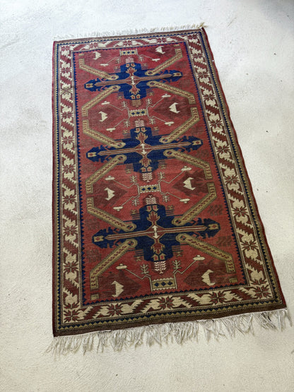 Tapis persan rouge vintage