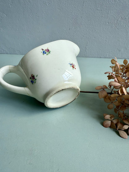 Ancien pot à lait en faïence émaillée décor floral