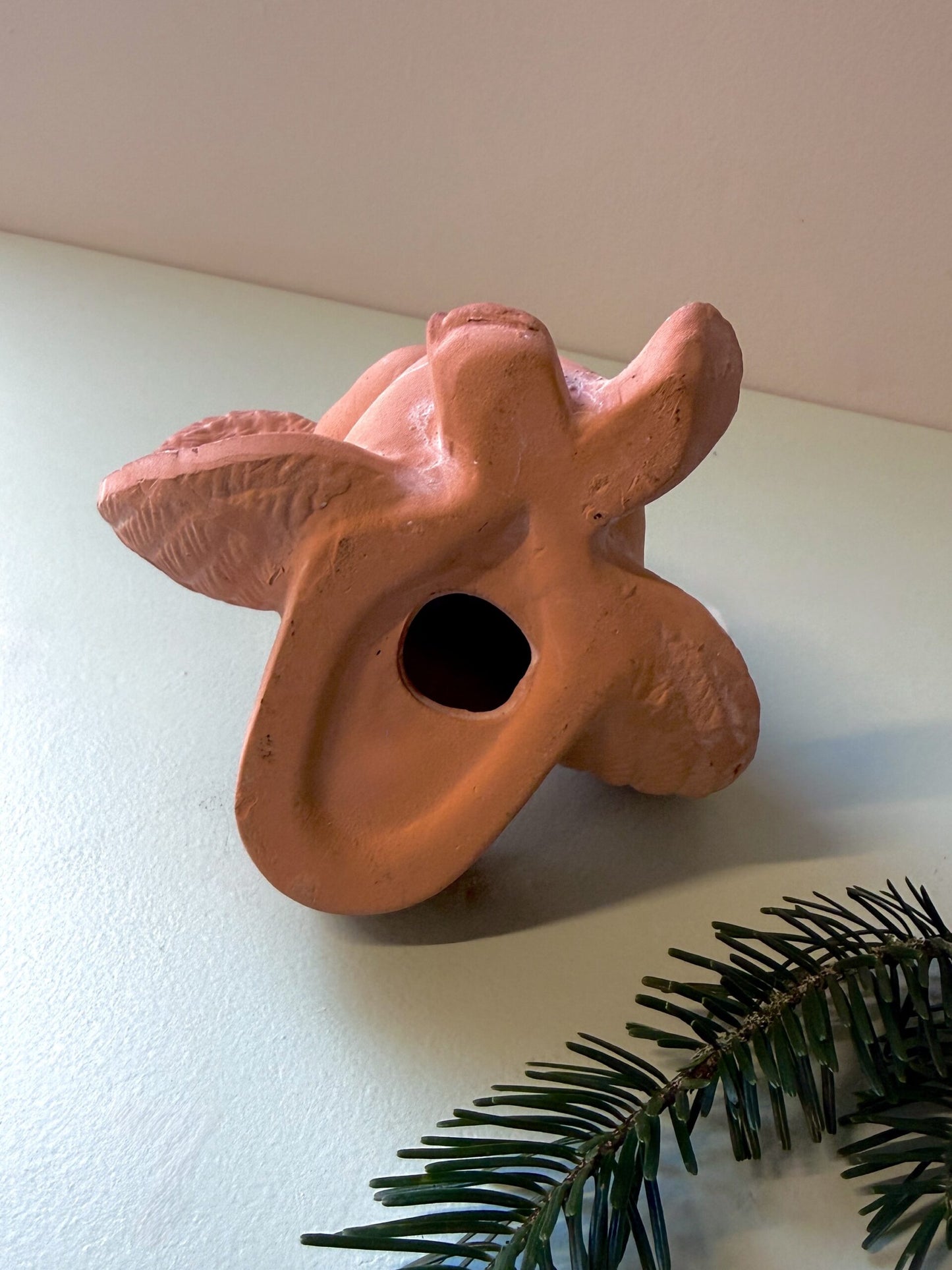 Bougeoir ange en terre cuite