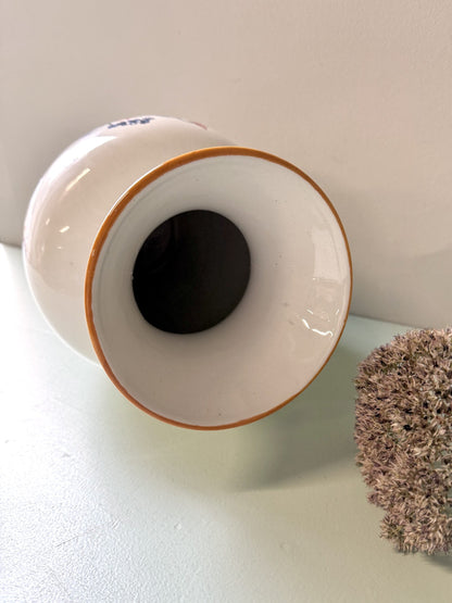 Vase en faïence avec frise florale