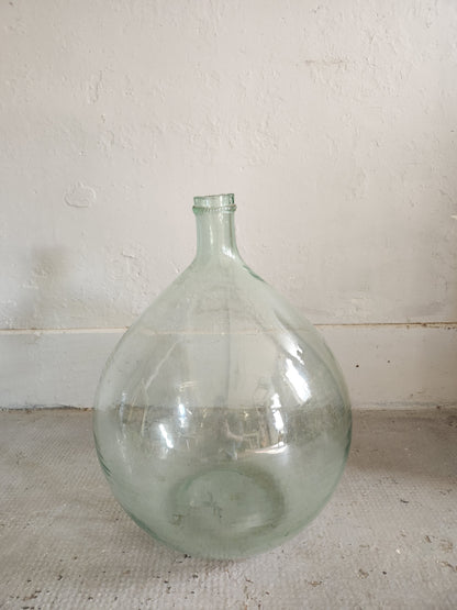 Grande dame-jeanne en verre transparent   Patine